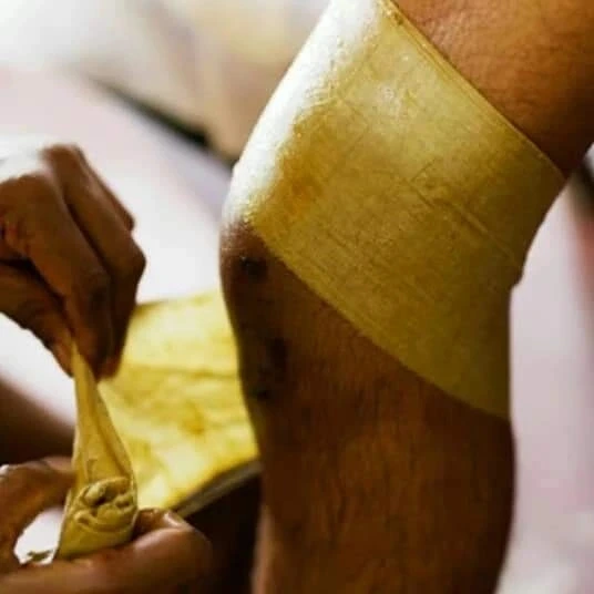 Herbal poultice applied to the knee